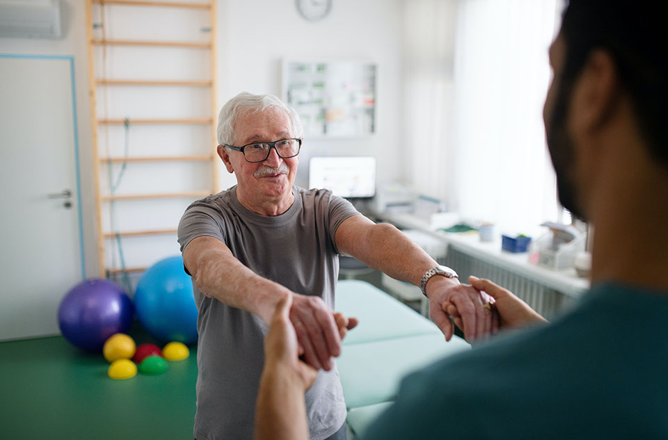 Man receiving physical therapy for stroke recovery